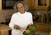 Older woman making dinner