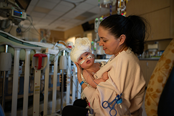 Liliya with baby Micaela, three days after separation surgery. 