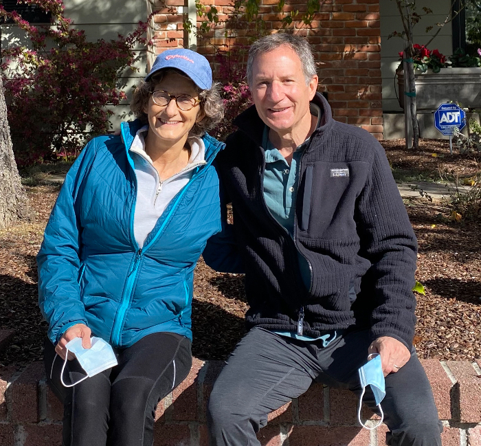 Margaret Gladstein, left, and Jeff Blumenthal greet each other in their East Sacramento neighborhood five days after transplant surgery.