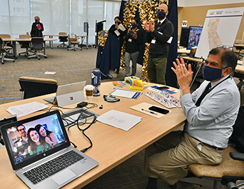 Sharad Jain, associate dean for students, celebrates with other faculty and staff during the virtual Match Day celebration Friday.