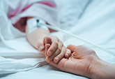 Mother holding a child's hand
