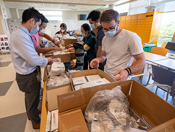 UC Davis medical students sort through donated medical supplies.