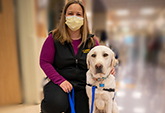 Daniels with his handler, Kristen Cady, who is a child life specialist who works in the UC Davis Pediatric and Cardiac Intensive Care Unit