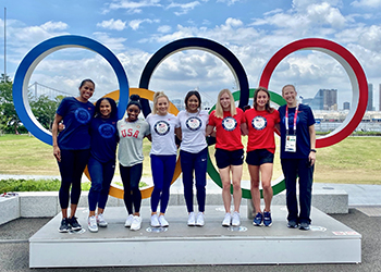 Marcia Faustin, left, with the USA Gymnastics Women’s Olympic Team