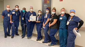 Nurse Manager Darrell Desmond, third from left, and Accelerated Access Unit members celebrate their PRISM Award.