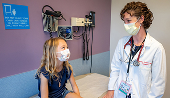 Scarlett Hershey in a checkup appointment with pediatric endocrinologist Stephanie Crossen.