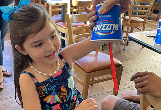 CMN Miracle Kid Avery Cunha enjoys a Blizzard at the Roseville DQ location.