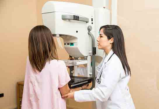 woman having a mammogram