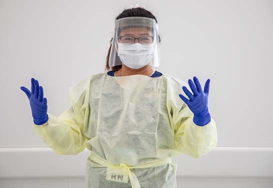 Nurse wearing mask, gloves and face shield