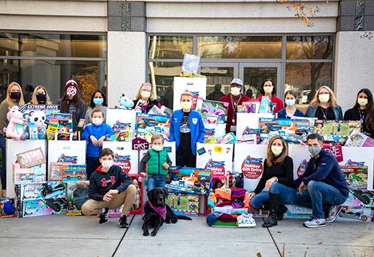 Photo of toys in bins in front of the Comprehensive Cancer Center