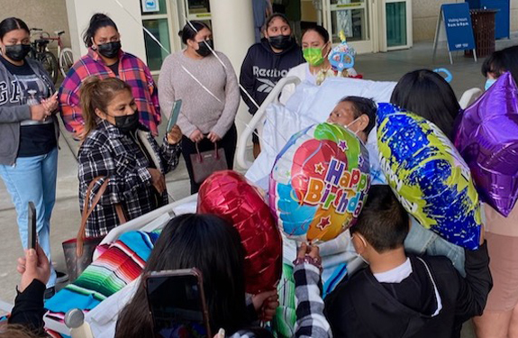 Patient Rogelio Lopez is surrounded by family and a mariachi ensemble to celebrate his birthday while still hospitalized.