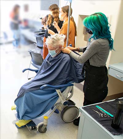 Alcove with stylists cutting people’s hair