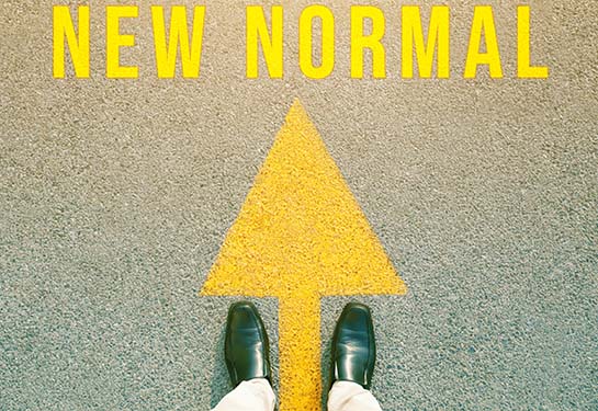 An arrow on the road that says New Normal. Concept new life after the outbreak of the Covid-19 virus.