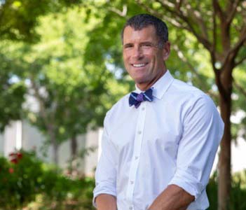 Dr. Lor Randall smiling and wearing a bow tie