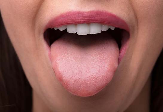 Woman&#x2019;s mouth with her tongue out