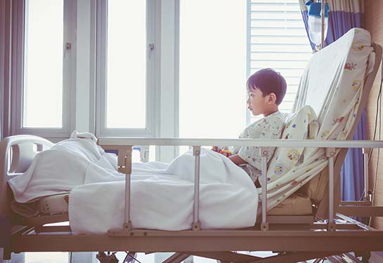 Young boy in a hospital bed