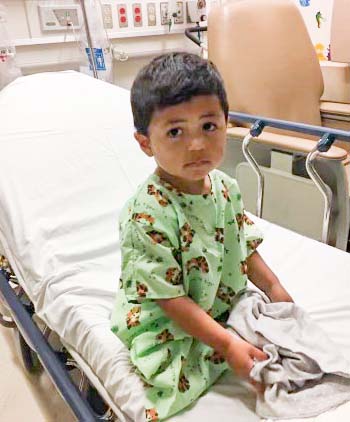 young male in a hospital bed