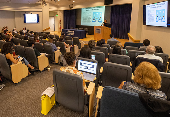 Audience participating in 28th Annual Cancer Research Symposium 