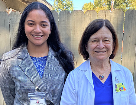 UC Davis student Prishha Thiagarajan stands with ophthalmologist Barbara J. Arnold at Bayanihan Clinic’s ophthalmology clinic