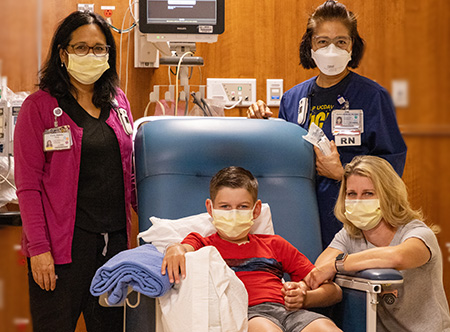 Adam Olson with his care team