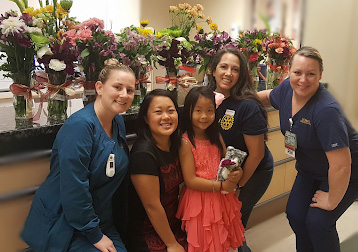 Annabelle and her mom with members of the care team