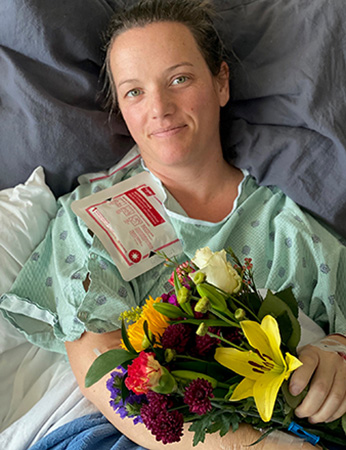 Patient Alisha Knudsen in hospital bed