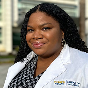 Portrait of medical student Chelsea Nash wearing white lab coat