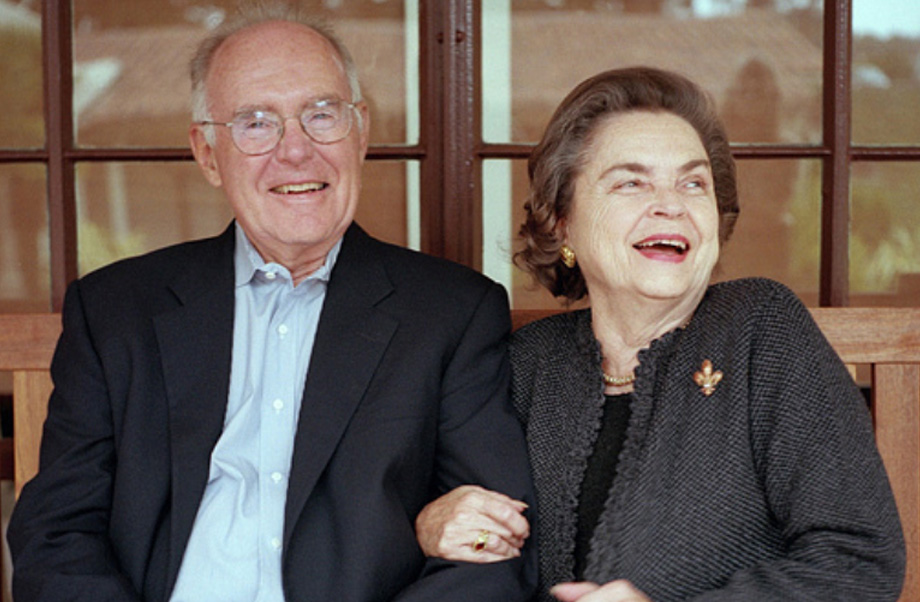 Gordon Moore, smiling, sits to the left of Betty Irene Moore while she smiles with her arm wrapped through his.