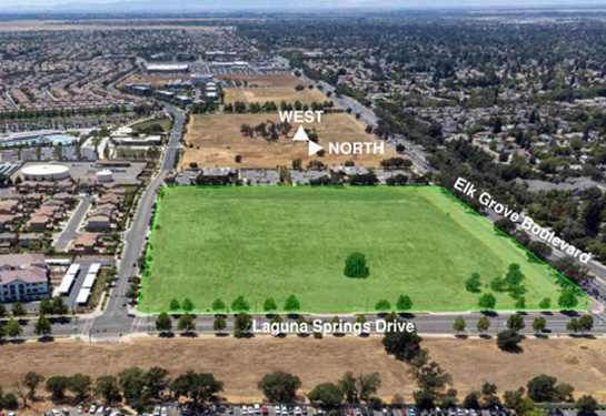 Aerial photo showing tract of grassy land at intersection of Laguna Springs Drive and Elk Grove Boulevard