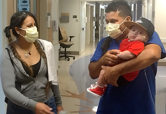 Mom, dad and JJ leaving the hospital roomt