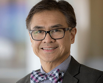 Asian American man with dark hair, wearing a bow tie
