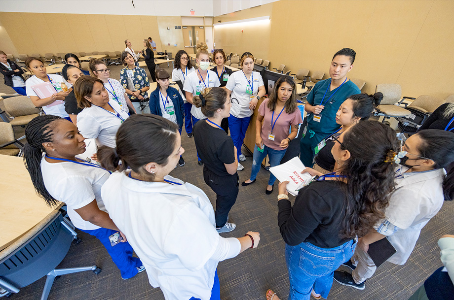 Overhead photo of nursing students in a circle in classroom