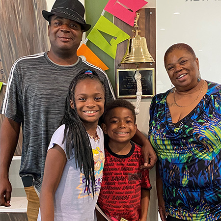10-year-old African American boy, his 11-year-old sister, their dad and their grandmother
