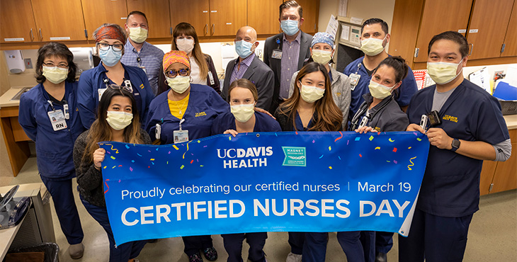 Certified nurses with banner
