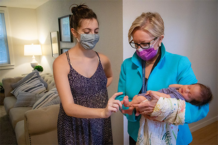 Dr. Diana Farmer with the first baby to undergo surgery 