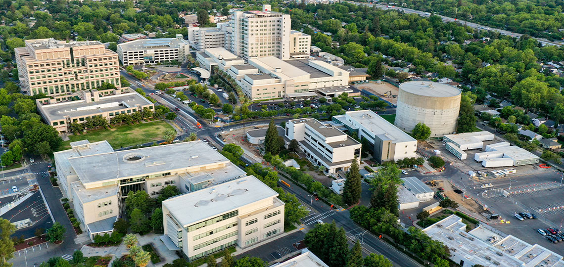 Aerial view of the UC Davis Medical Center campus with downtown Sacramento skyline in the distance