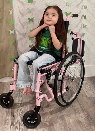 Alaina Daniels in her pink wheelchair