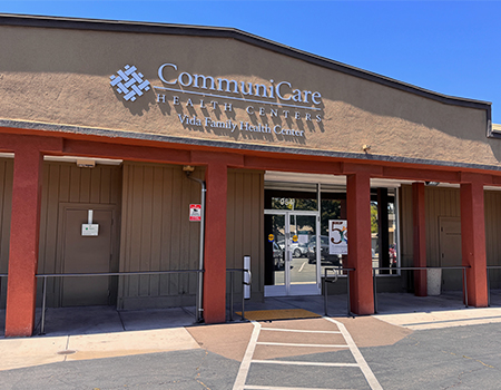 A brown one-story building with sign on the front that reads: “CommuniCare Health Centers, Vida Family Health Center.”