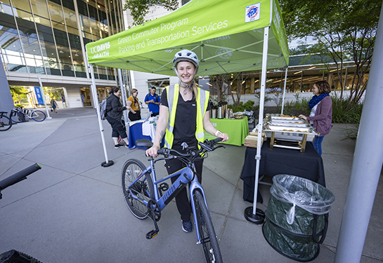 Staff poses with bicycle