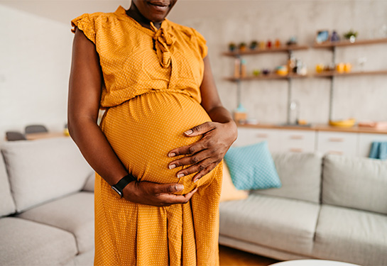 Black woman enjoying pregnancy at home