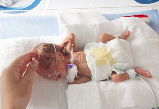 Small baby in NICU incubator