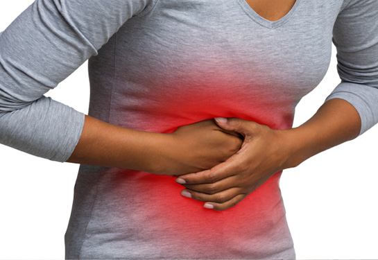 A woman holds on to her stomach which is accentuated with a red zone that indicates pain in the abdominal cavity.