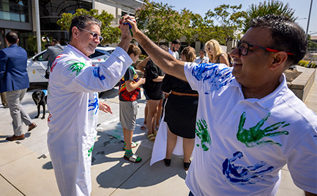 Two men giving a high five