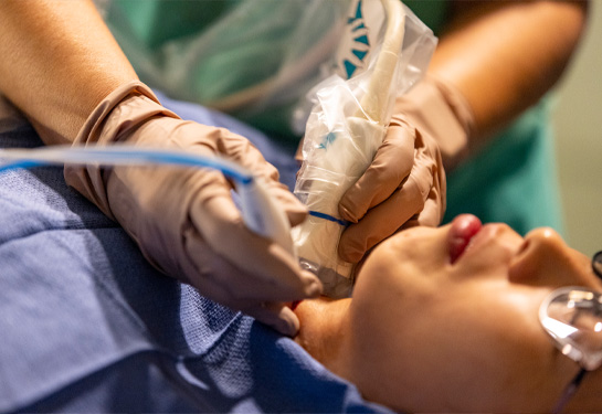 Patient during procedure with radiofrequency tool directed at her neck