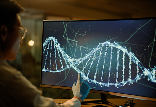 Scientist pointing to a screen with a DNA helix