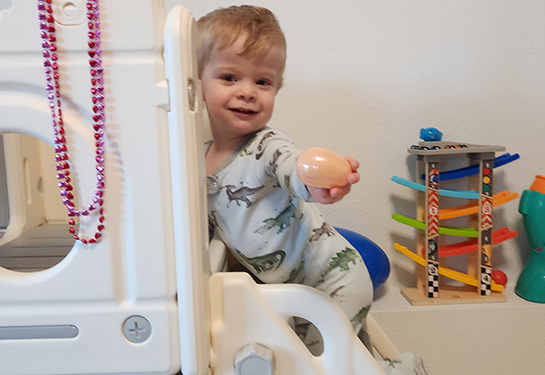 Child on play equipment