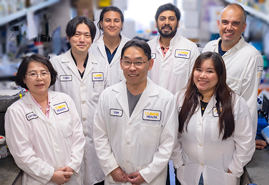 Group of people standing in a lab