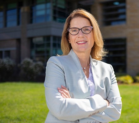 Image of Dr. Aubyn Stahmer, standing outside the UC Davis MIND Institute