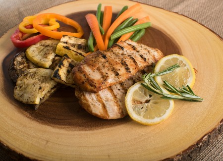 Plate full of salmon and steamed veggies