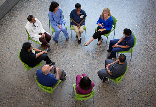 group of people sitting in a circle